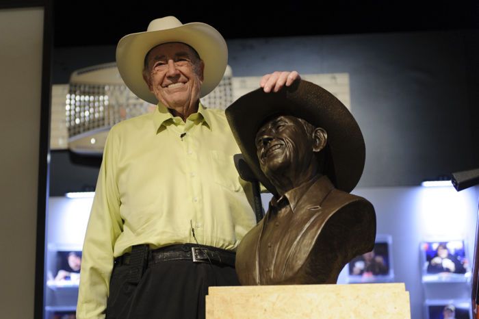 Doyle Brunson with his bust.